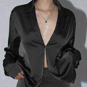 Black blouse from commense boutique. size xs and never worn- still with tags.